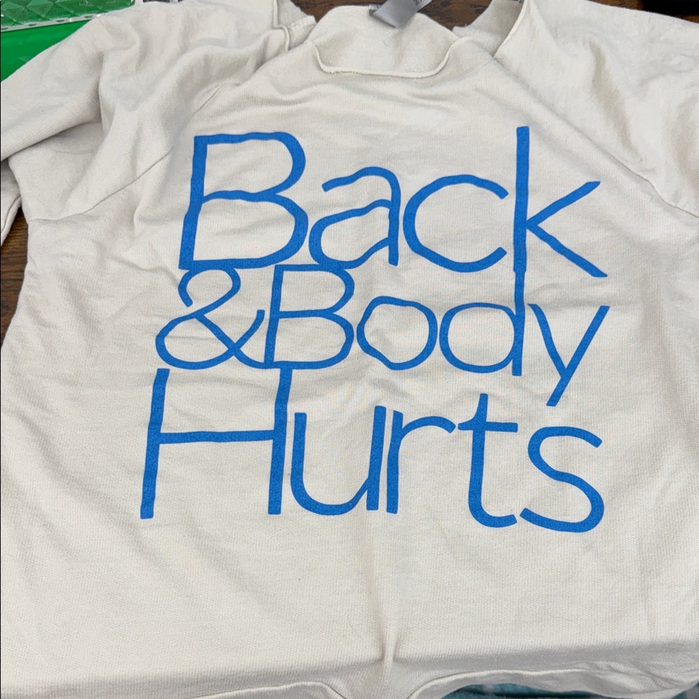 Cream off shoulder top.